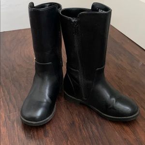 Little girl riding boots